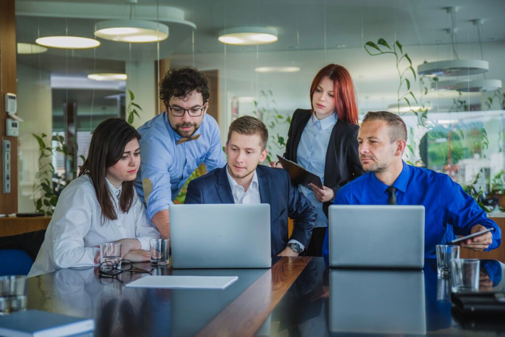 Digital marketing experts planning localized landing pages for small business

